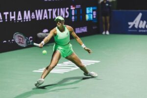 Caroline Dolehide playing a backhand during the tennis qualifying round match in 2026