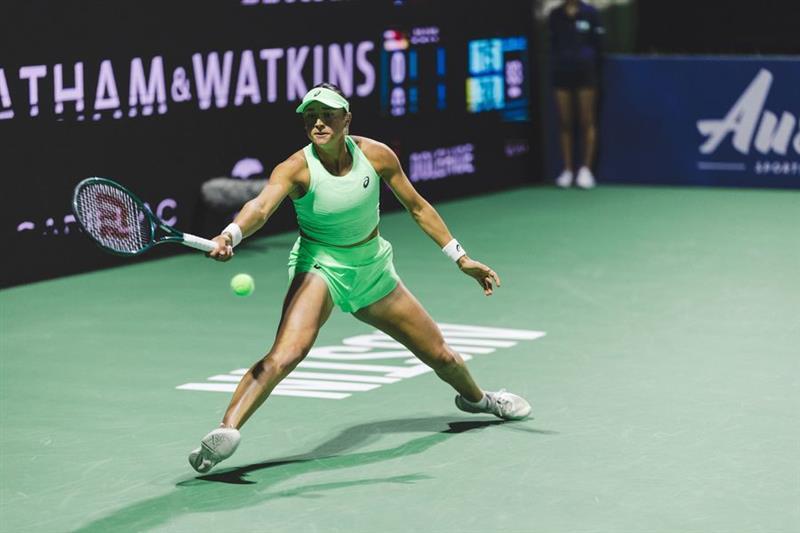 Caroline Dolehide playing a backhand during the tennis qualifying round match in 2026