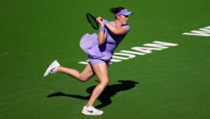 Elvina Kalieva playing a backhand during the 2026 tennis qualifying round match